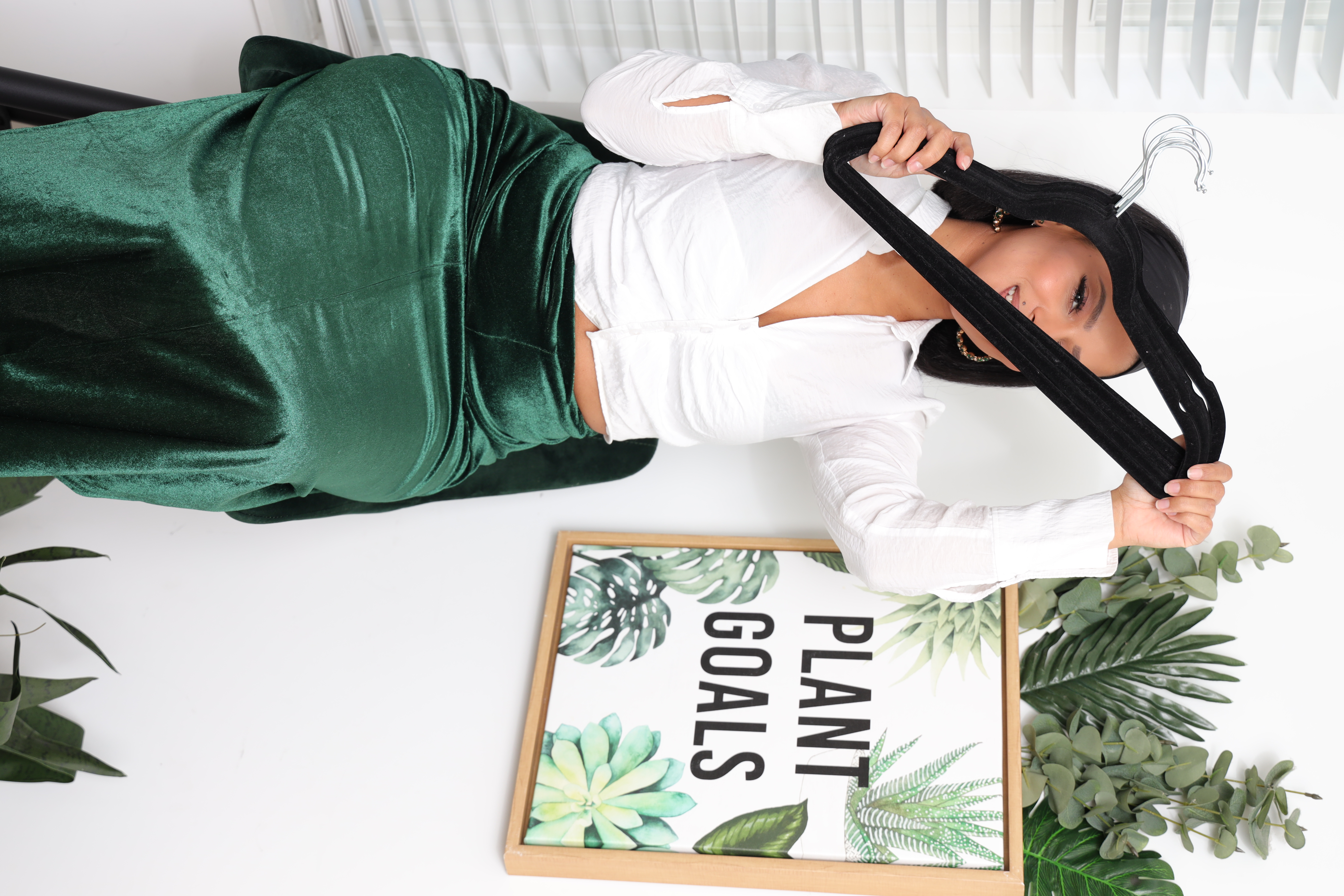 Brittany styling in an emerald outfit with greenery